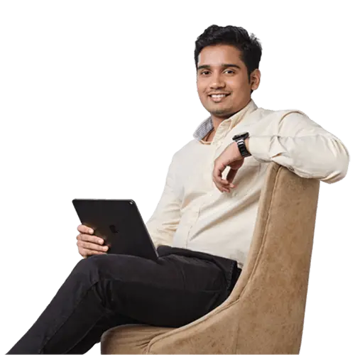 Smiling happy indian student with backpack pointing his finger wall